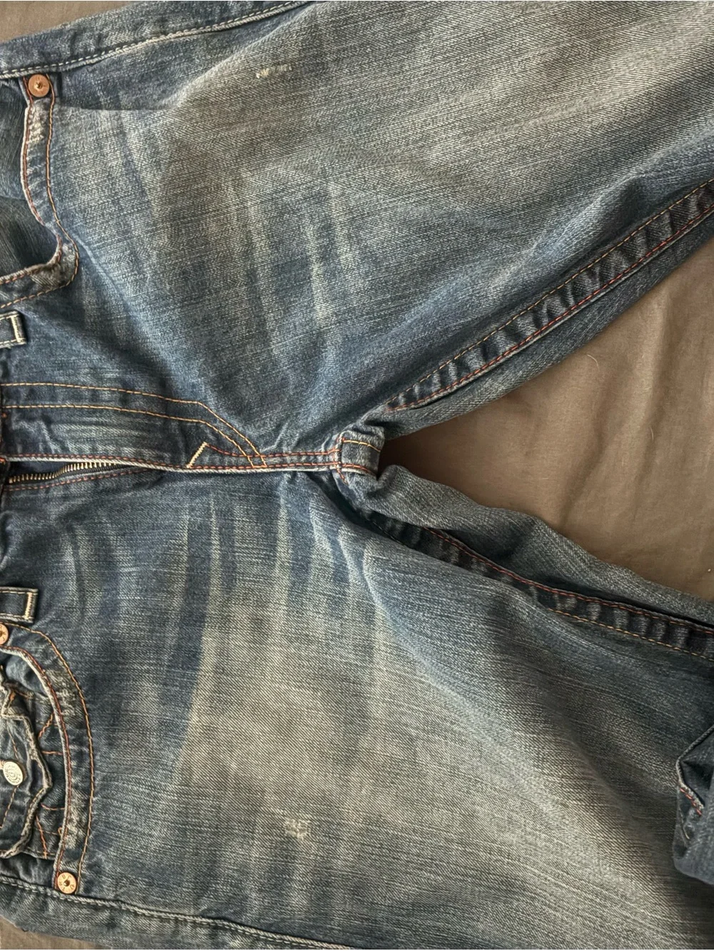 True Religion Men's Straight Jeans in Medium Blue with Distressed Hem